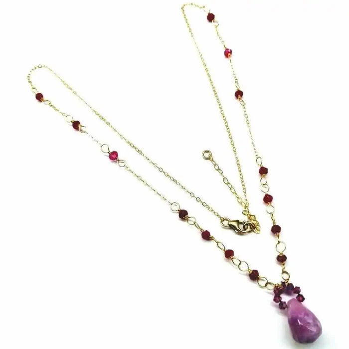Lilac Jade Drop Gemstone Wire Wrapped Gold Filled Necklace showcasing a lavender drop pendant and gold chain with red gemstones.