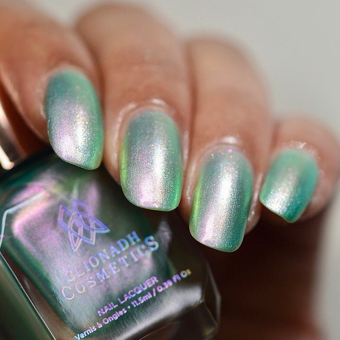 Close up of nails done with Lineage nail lacquer on medium skin tone.