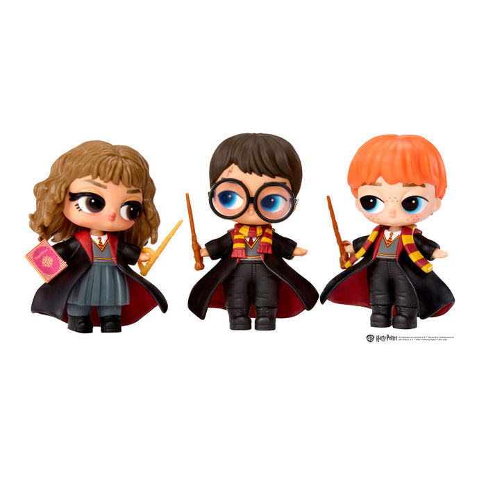 Three tots Hermione, Harry Potter and Ron all holding wands on a white background