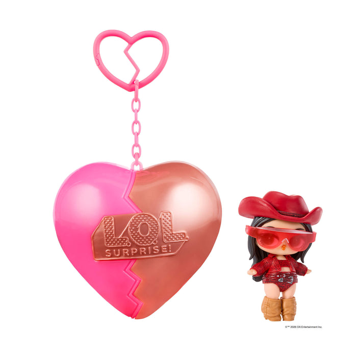Small doll with black hair – sunglasses and red cowgirl hat with a heart shape keychain on a white background