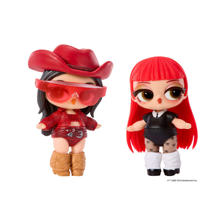 Tot as a cowgirl and tot with long red hair dressed in black on a white background