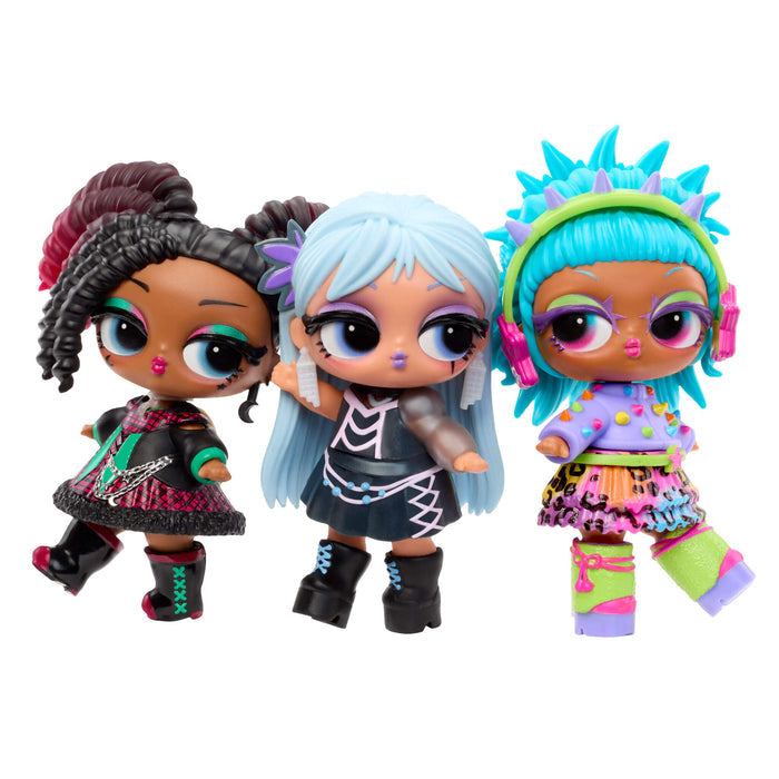 Three dolls with colorful hair on a white background