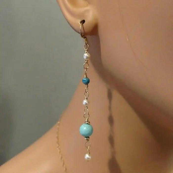 Long 14 K Gold Filled Turquoise Pearl Earrings showcasing elegant design with turquoise and pearl accents.