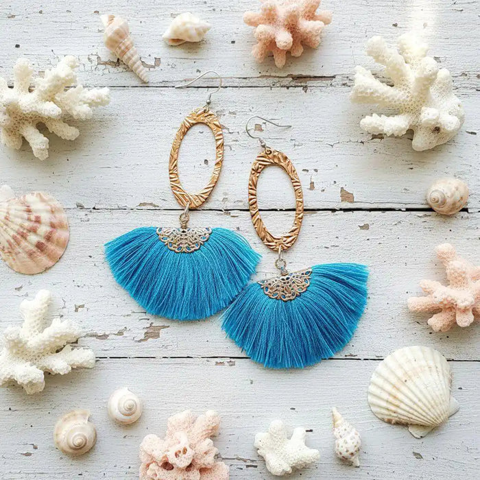 Long Copper Embossed Aqua Brushed Silk Fan Tassel Earrings with aqua tassels and golden metal accents