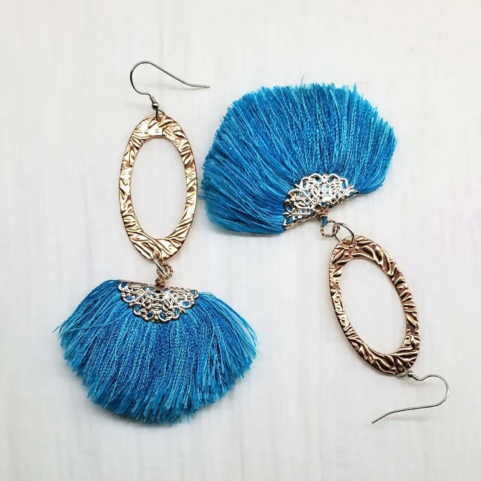 Long Copper Embossed Aqua Brushed Silk Fan Tassel Earrings with intricate metalwork and bright aqua silk tassels.