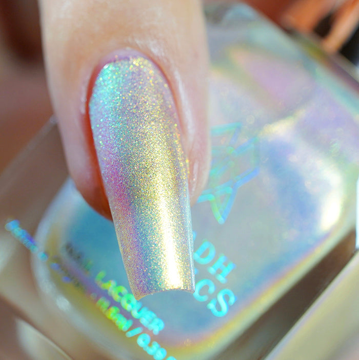 Close up shot of one long nail done with Lux Nail Lacquer on fair skin tone.