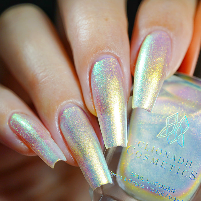 Close up shot of long nails done with Lux Nail Lacquer on fair skin tone.