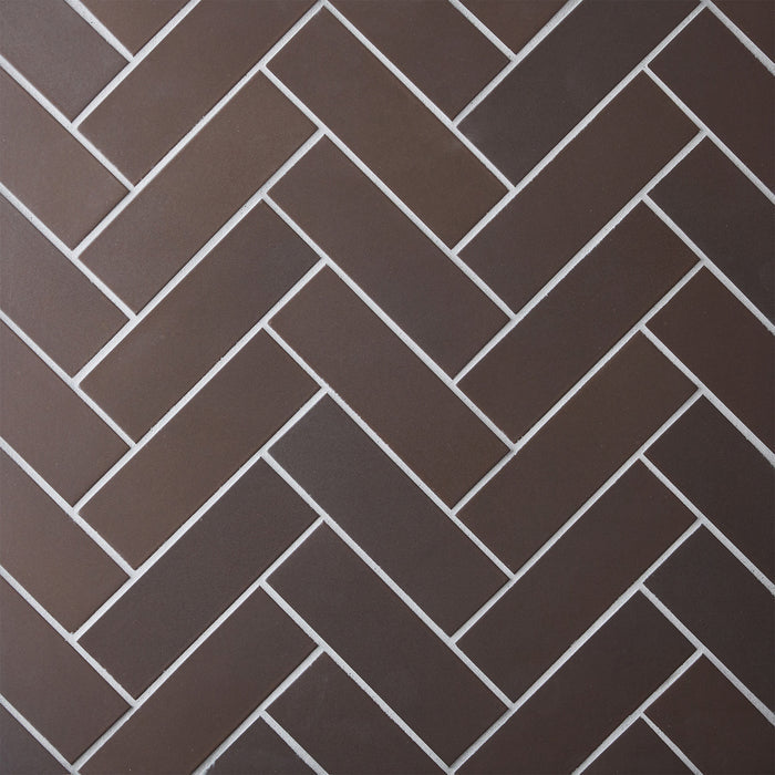 Caption: Classic Field 2x6 in M39.2 Matte Brown. Prism Winter Grey grout by Custom Building Products.