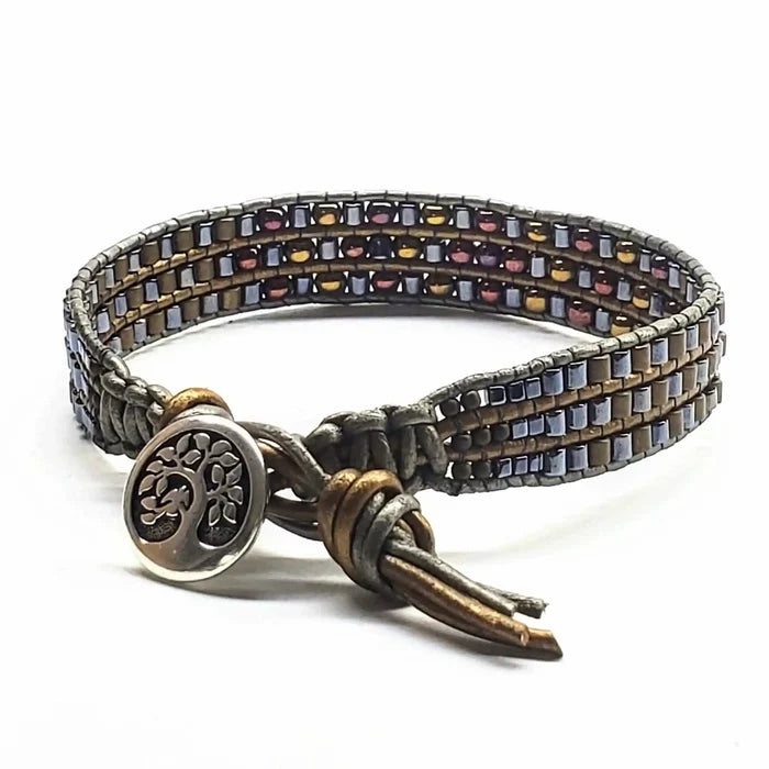 Men's Intricately Beaded Leather Tree of Life Bracelet showcasing colorful beads and tree charm.