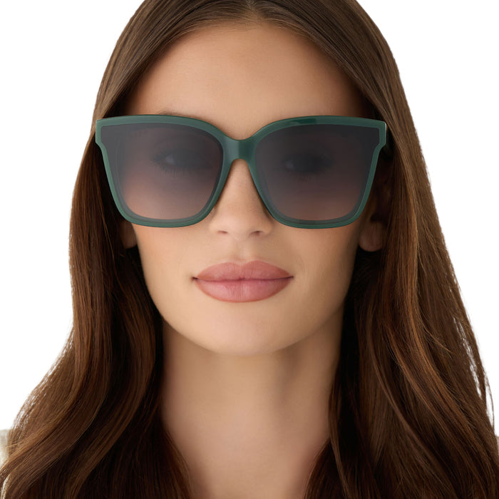 on model - female wearing diff eyewear featuring the meredith ii square oversized sunglasses with a fairway green acetate frame and grey gradient lenses front view