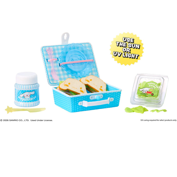 Mini children's lunch set with a blue picnic box, and bottle on a white background