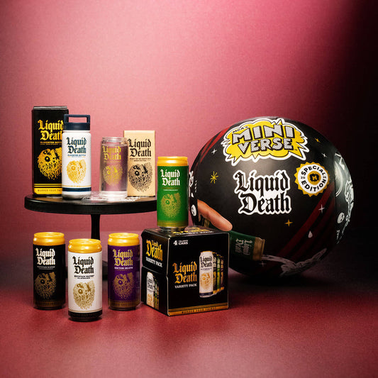 Collection of 'Liquid Death' products including cans, a box, and a large sphere with branding on a red background.