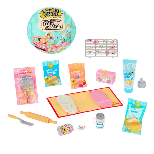 Miniature baking set with tools and ingredients on a white background