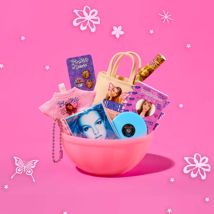 Pink bowl filled with various items on a pink background with decorative elements.