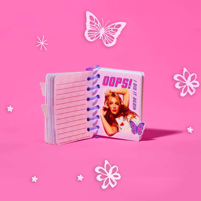 Pink notebook with butterfly designs on a pink background