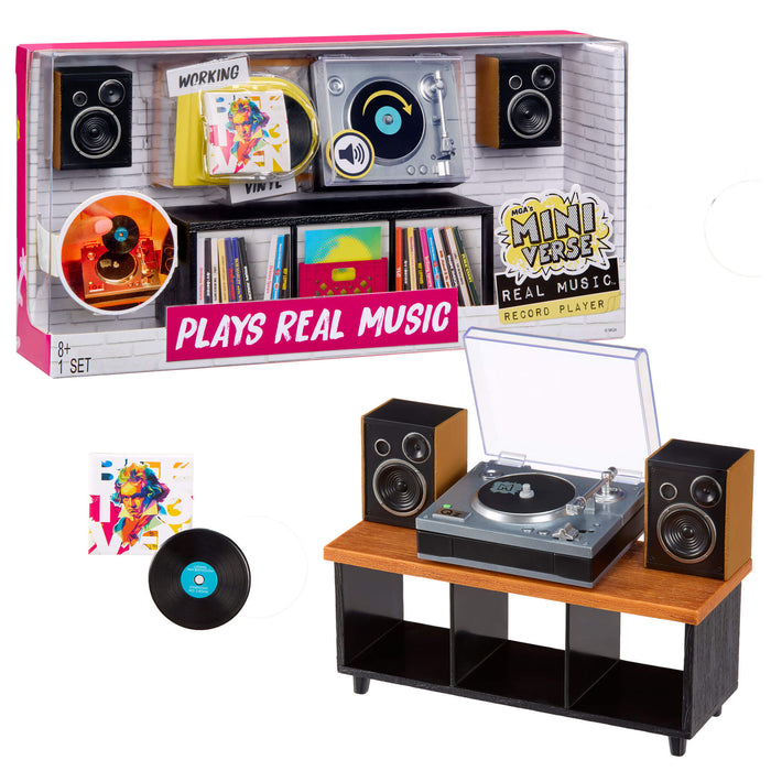 Mini toy record player set with packaging, speakers and a vinyl record on a white background