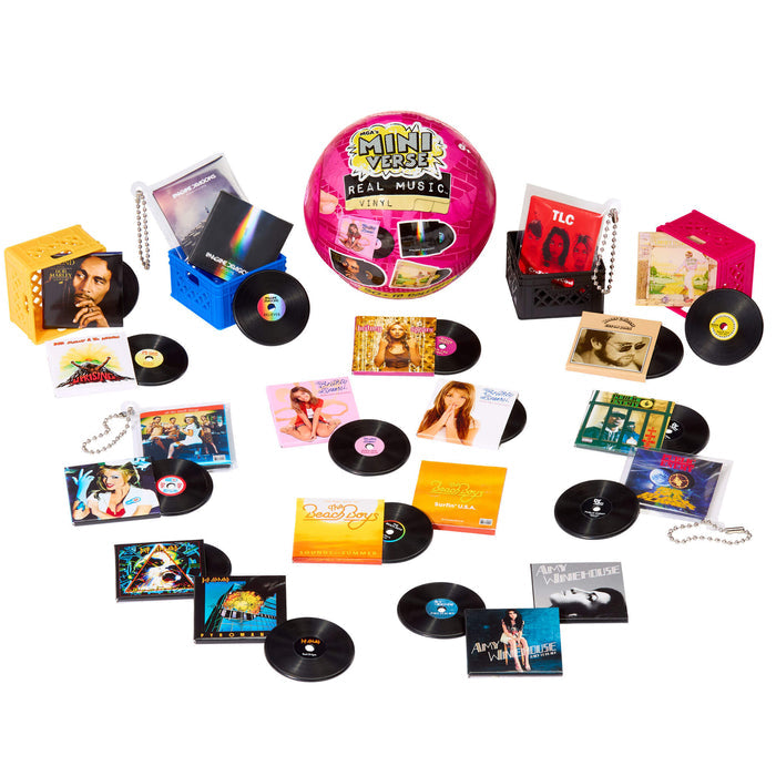 Collection of miniature vinyl records and packaging on a white background