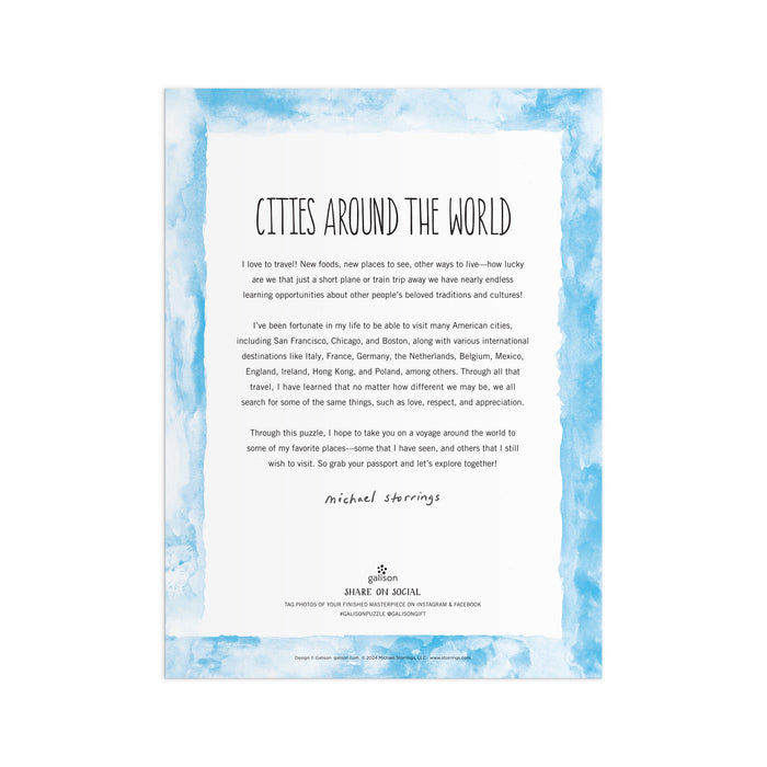 A letter titled Cities Around The World appears on a white page with a light blue watercolor border, inspired by the Michael Storrings Cities Around the World 1000 Piece Puzzle by Michael Storrings. The text discusses travel and lists cities; signed at the bottom.