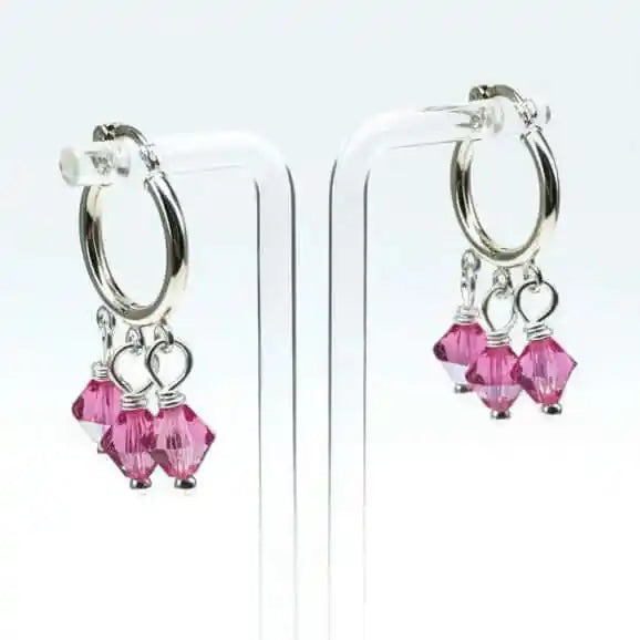Mini Sterling Silver Hoop Pink Crystal Dangle Earrings showcasing pink Swarovski crystals on silver hoops.