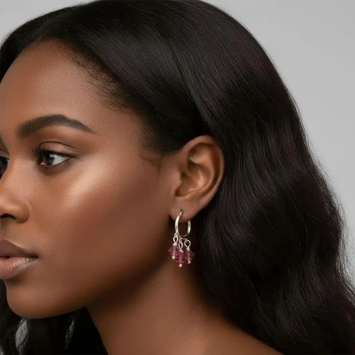 Model wearing Mini Sterling Silver Hoop Pink Crystal Dangle Earrings showcasing elegant design and sparkly pink crystals.
