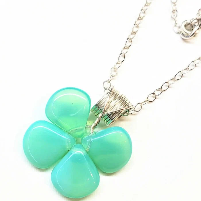 Mint green beaded clover necklace featuring Czech glass beads with a sterling silver chain.
