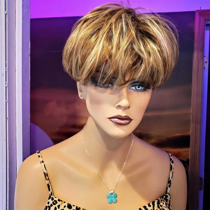 Model displaying a mint green beaded clover necklace, featuring a stylish short haircut and fashionable attire.