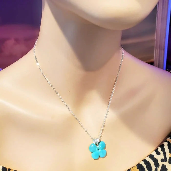 Mint green beaded clover necklace shown on a mannequin, featuring sterling silver chain and Czech glass beads.