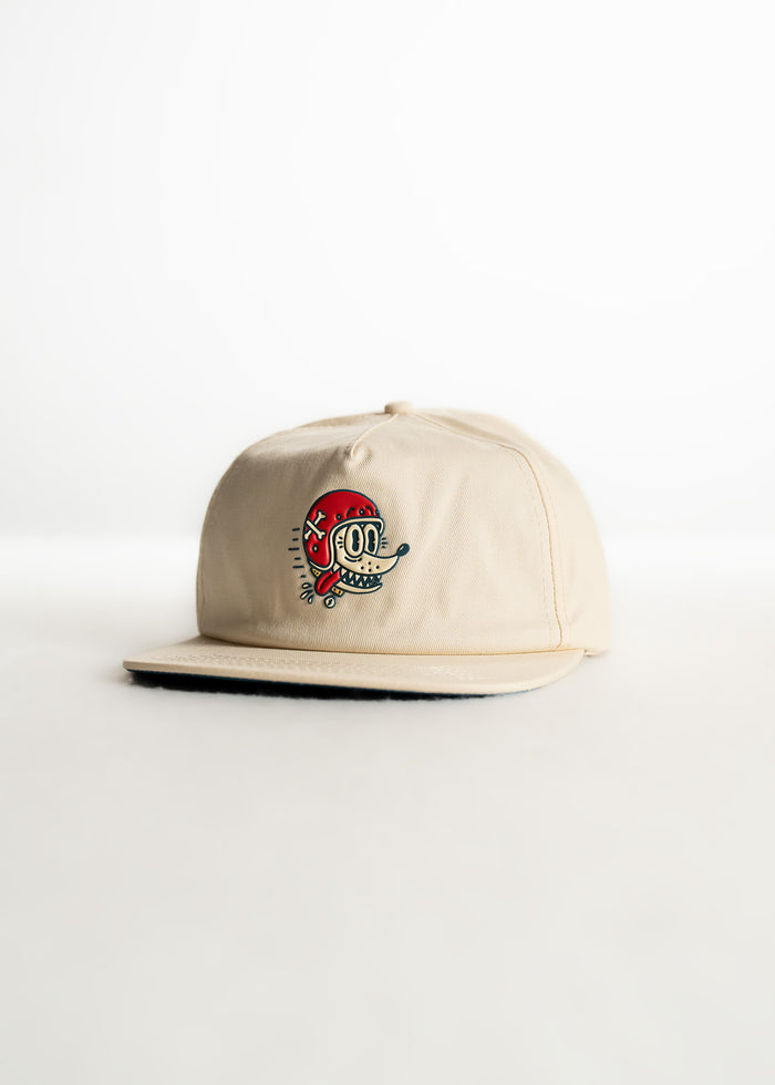 Beige cap with a colorful cartoon skull design on the front, set against a plain white background.
