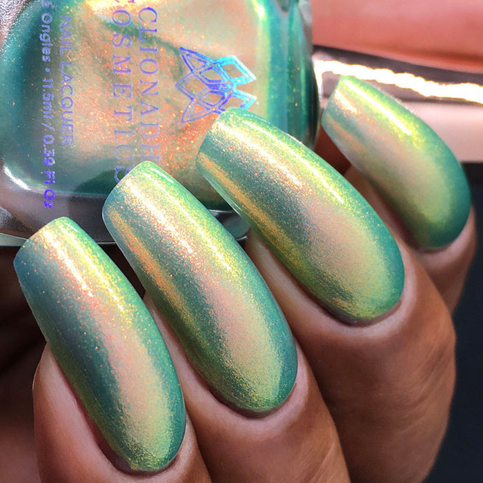 Bottom angled shot of nails done with Mural Nail Lacquer on medium skin tone