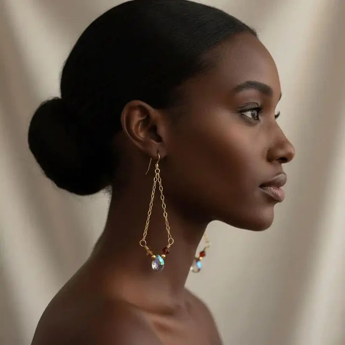 Mystic Rainbow Quartz Drop Gold Filled Earrings worn by model, showcasing their iridescent beauty and gold-filled design.