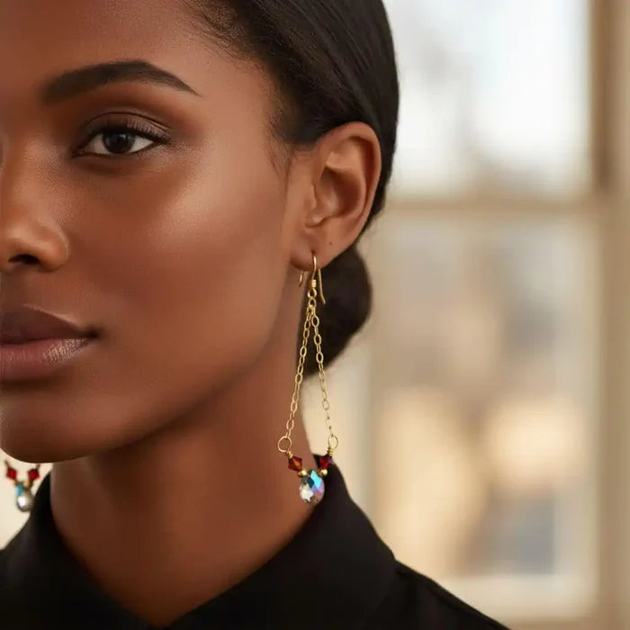 Close-up of model wearing mystic rainbow quartz drop gold filled earrings with colorful accents.