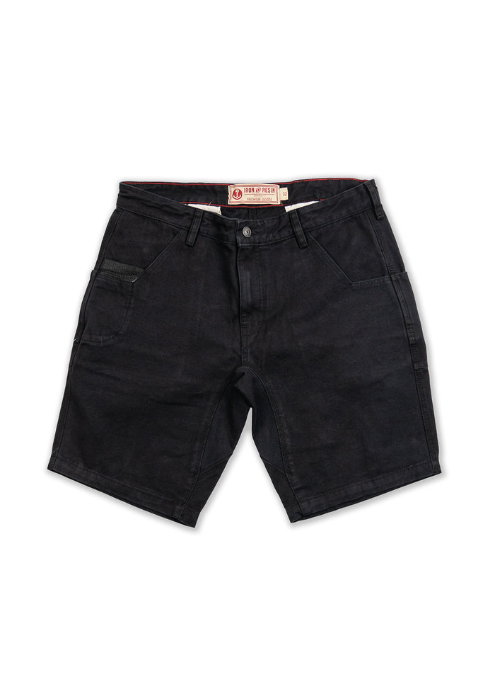 Black denim shorts with front pockets and belt loops, featuring an Iron & Resin label on the waistband, laid flat on a white background.