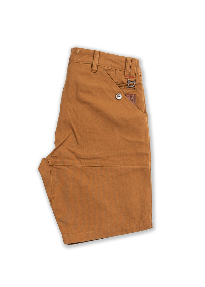 Brown work shorts with a side pocket and belt loops, featuring a button and logo patch, laid flat on a white background.