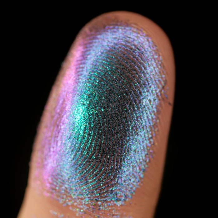 Macro finger swatch of Oculus Lite on fair skin tone.