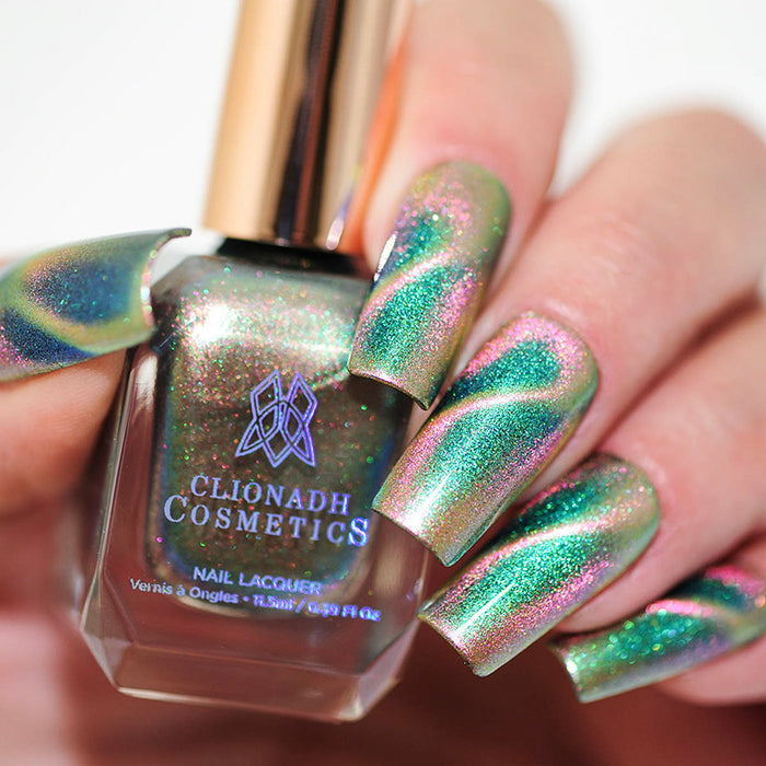 Close up of nails done with Psilocybin Nail Lacquer featuring a design to show off the magnetic effect on fair skin tone.