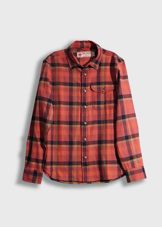 Red and black plaid flannel shirt with buttons and a single chest pocket, displayed against a plain white background.