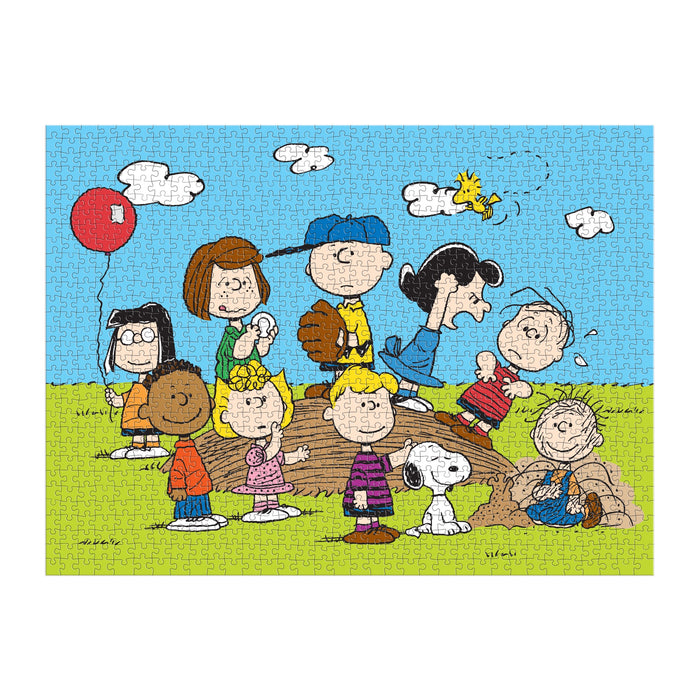 The Peanuts Baseball 1000 Piece Puzzle by Peanuts Worldwide LLC. features Charlie Brown, Snoopy, and friends on a grassy field under a blue sky with Woodstock flying above—perfect for Peanuts fans and puzzle lovers alike.
