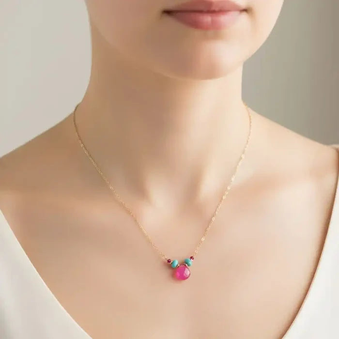 Gold Filled Turquoise and Pink Gemstone Drop Necklace worn by a model, showcasing colorful gemstones on a delicate chain.