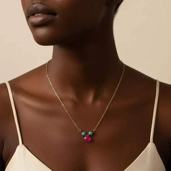 Gold Filled Turquoise and Pink Gemstone Drop Necklace worn by a model showcasing its vibrant colors and elegant design.