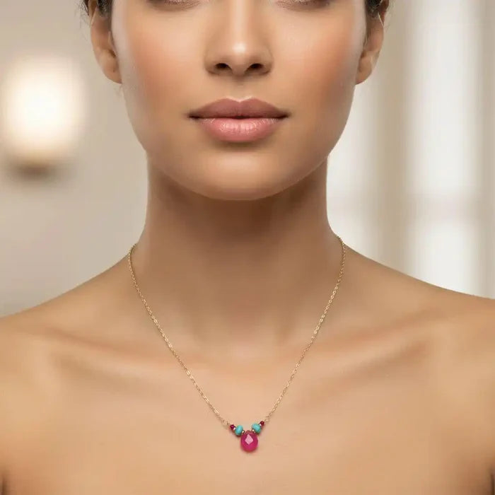 Gold Filled Turquoise and Pink Gemstone Drop Necklace worn by a model showcasing vibrant gemstones on a gold chain.