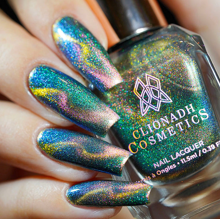 Close up shot of nails done with Psilocybin Nail Lacquer featuring a design to show off the magnetic effect on fair skin tone