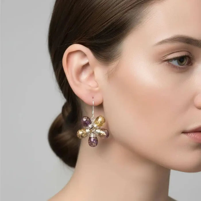 Close-up of a woman wearing Purple and Yellow Flower Sterling Silver Earrings with vibrant Czech glass beads.