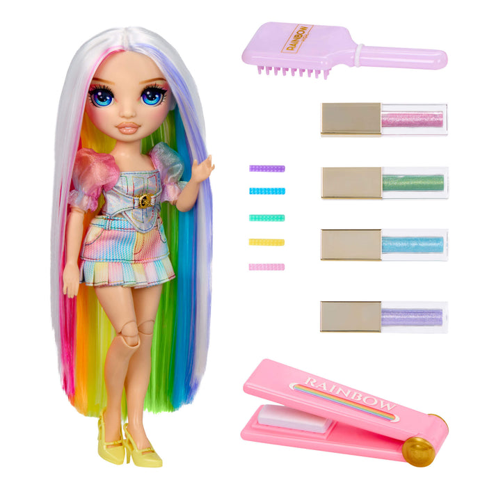 Toy doll with colorful hair and hair styling tools on a white background