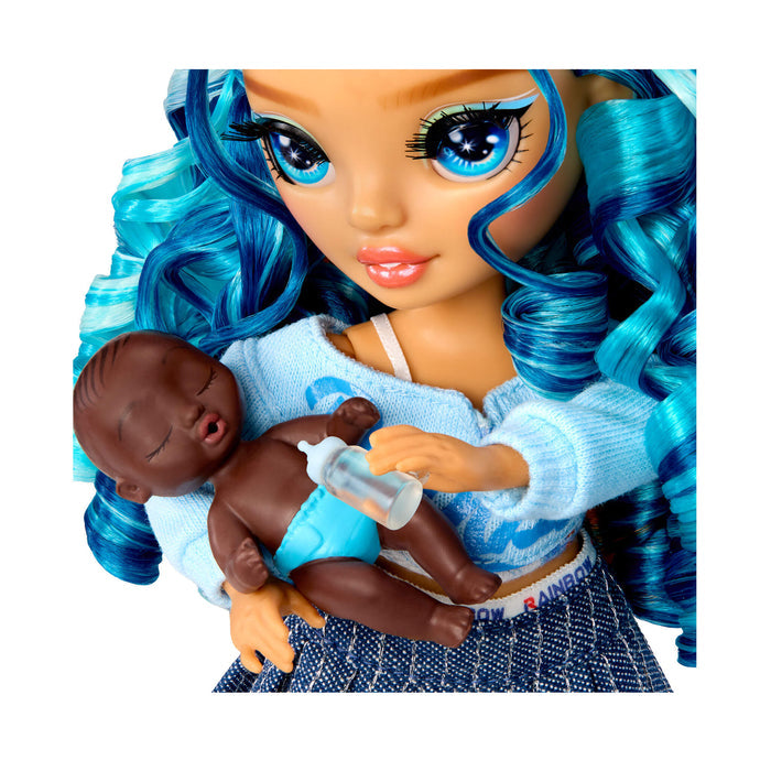 Close up of doll holding baby on a white background