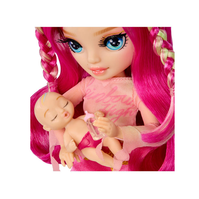 Close up of doll holding baby on a white background