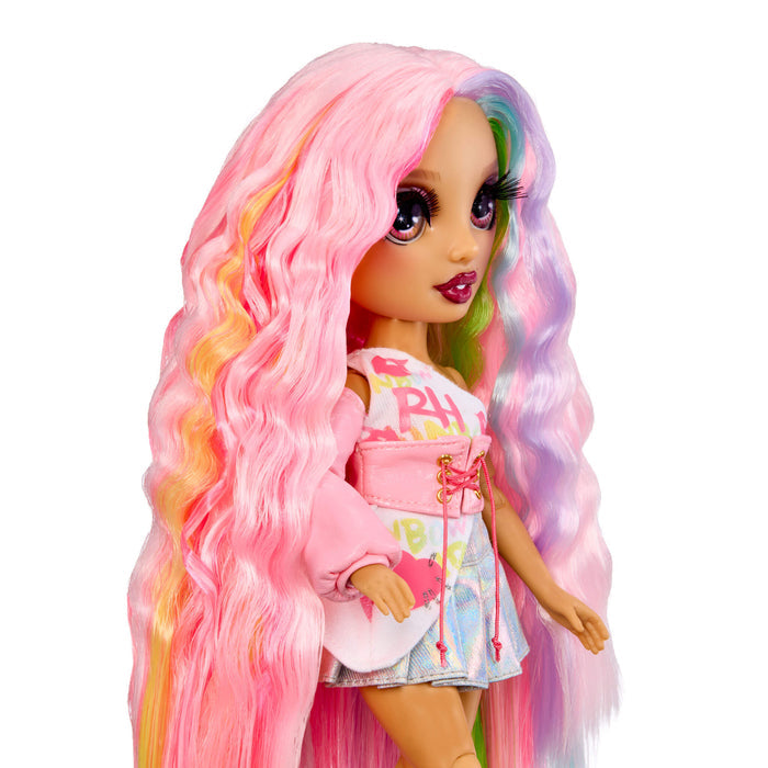 Doll with long, colorful hair on a white background