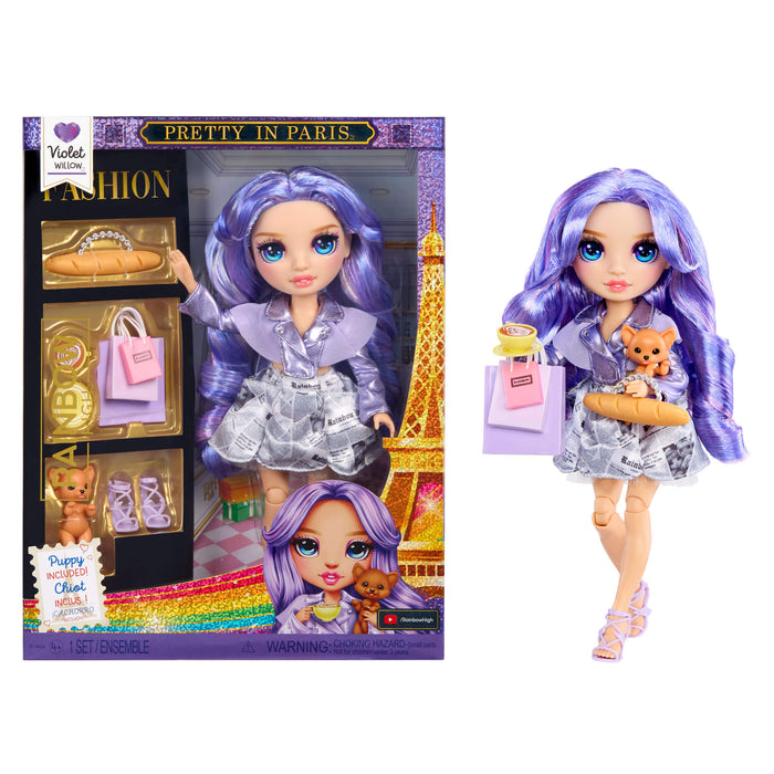 Doll with purple hair and outfit next to its packaging featuring the Eiffel Tower.