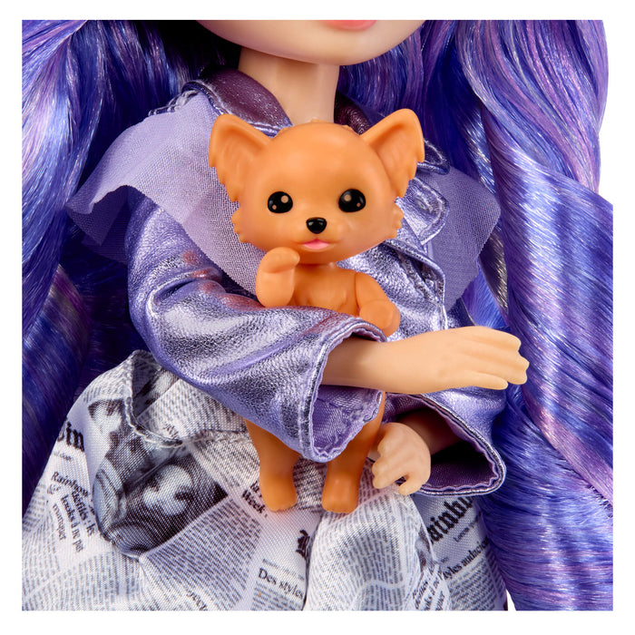Close-up of a doll with purple hair holding a small tan dog, wearing a skirt with newspaper print.