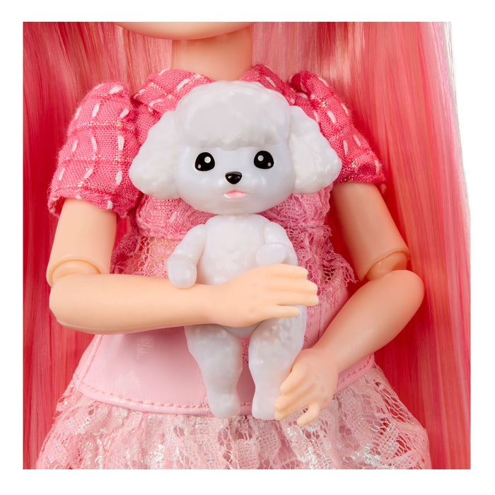 Doll holding a small white dog toy with pink hair and dress
