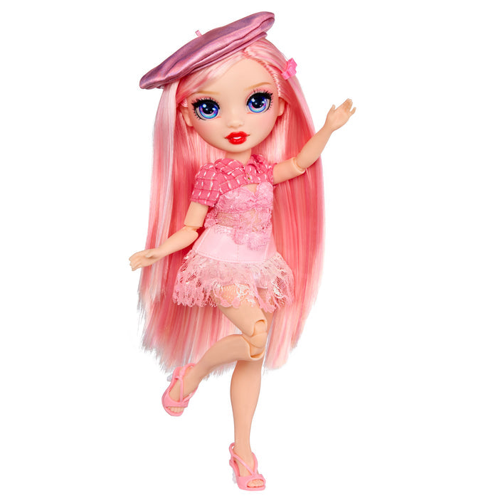 Toy doll with pink hair and dress on a white background